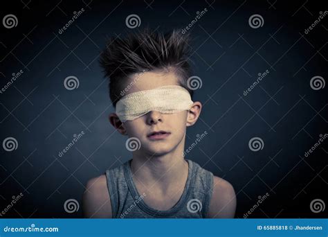 Young Boy with Bandage on Eyes Against Gray Stock Photo - Image of ...