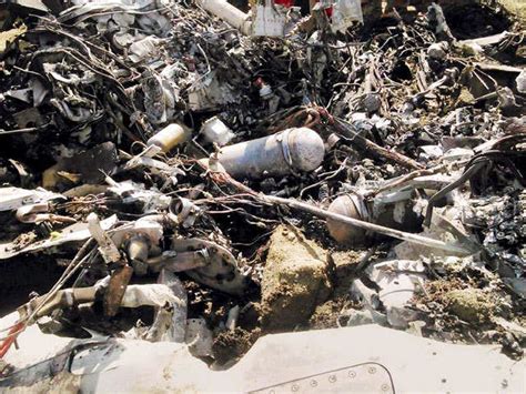 Crowd gathered around the crashed jet - Indian Air Force's jet trainer ...
