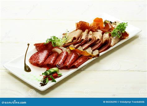 Cold cuts or meat platter stock photo. Image of dish - 86536290
