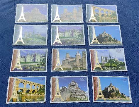 UN set of 6+6 beautiful stamps with gold embossed Eiffel tower from Ne ...