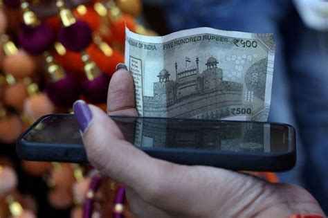 Rupee recovers from record low, helped by foreign banks' dollar sales ...