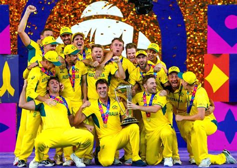 Australian players celebrate with the trophy after winning the ICC Men ...