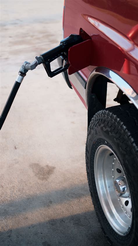 Download wallpaper 2160x3840 car, gas station, wheel, red samsung ...