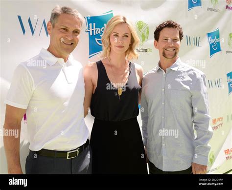 Hasbro President and CEO Brian Goldner, right, actress Charlize Theron, center and WME Co-CEO ...