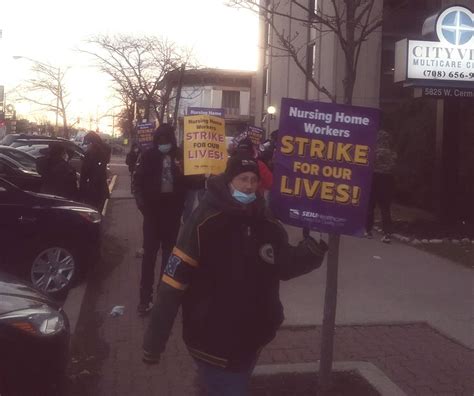 Illinois nursing home workers strike in second week as pandemic surges ...