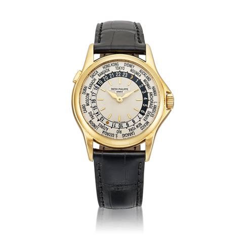 Patek Philippe | Reference 5110 | A yellow gold world time wristwatch, Retailed by Tiffany & Co ...