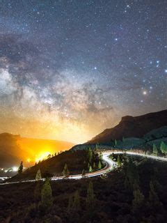 Download wallpaper 240x320 road, mountains, night, lights, stars old ...