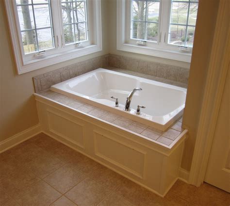 Custom Paneled Front Bathtub with Tile Tub Deck