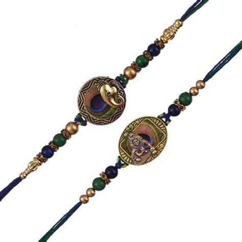 Buy eCraftIndia Set of 2 Lord Ganesha and Krishna Peacock Feather ...