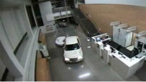 Woman caught on camera crashing through LAPD lobby with infant in ...