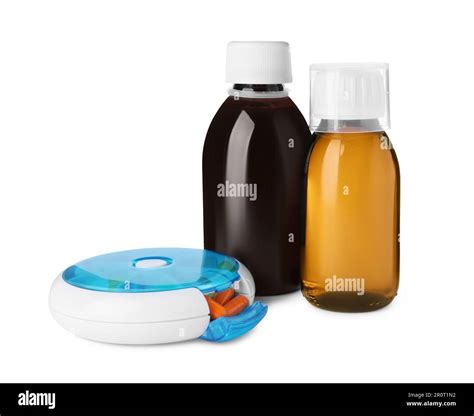 Bottles of syrups, measuring cup with pills on white background. Cough ...