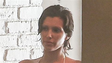 Bianca Censori busts out of barely-there bikini top and white spandex ...