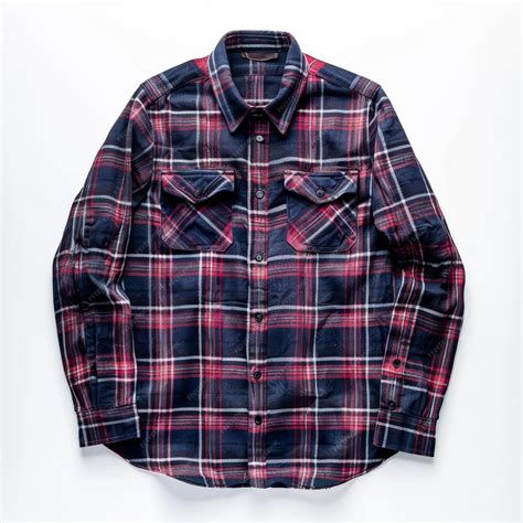 A blue and red plaid flannel shirt with long sleeves two chest pockets ...