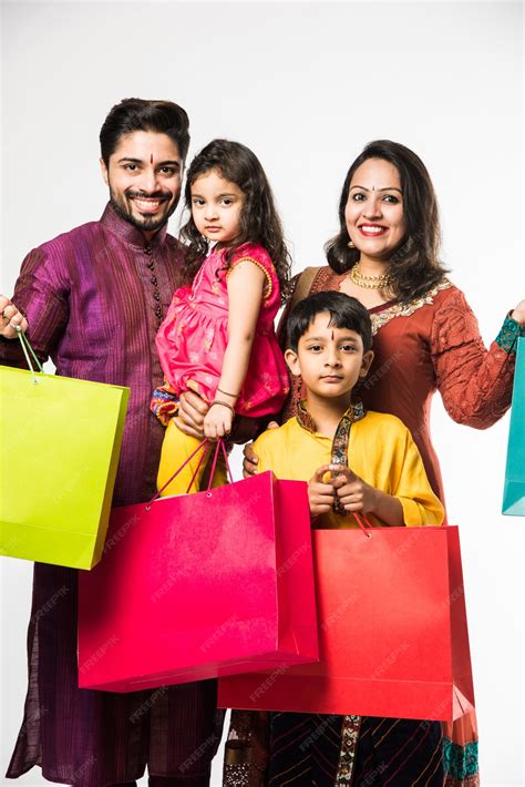 Indian family celebrating diwali or deepavali in traditional wear with ...