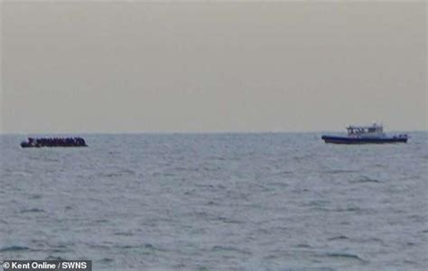 Moment migrant dinghy trying to cross English Channel diverts Dunkirk ...