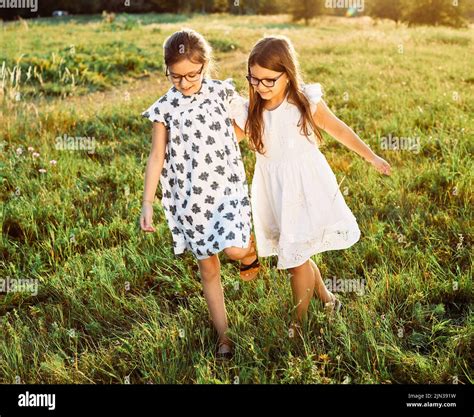 child summer fun lifestyle sister friend outdoor girl field friendship ...