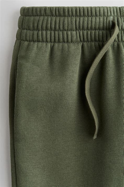 Brushed-inside joggers - Dark khaki green - Kids | H&M IN