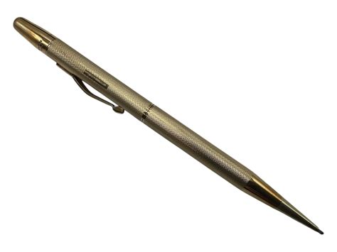A 9ct gold cased propelling pencil with engine turned decoration ...