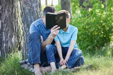 Premium Photo | Father and child reading the bible concept family