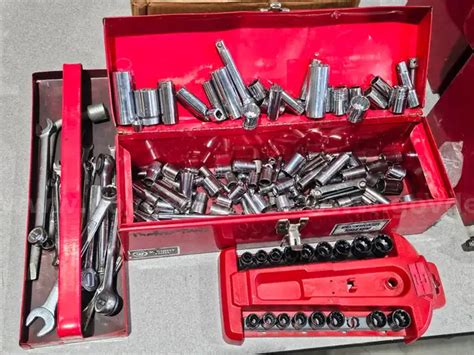Tool box of various loose sockets, wrenches and ratchets. | AllSurplus