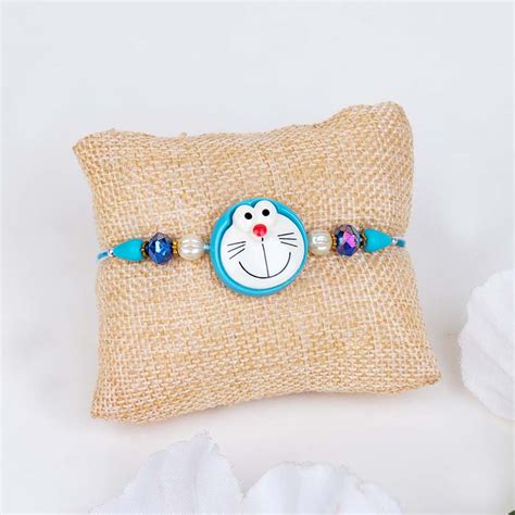 Send Doraemon Rakhi with Jade Plant and Mug Gift Pack Online - RKH23 ...