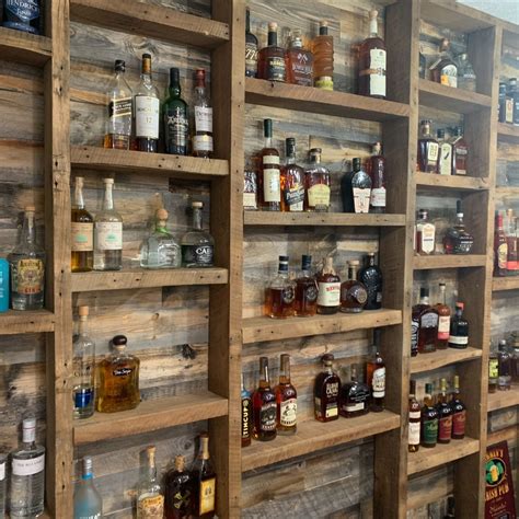 Bourbon display with reclaimed wood home bar | Diy home bar, Basement ...