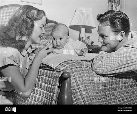 Actress Shirley Temple and husband John Agar play with their three ...