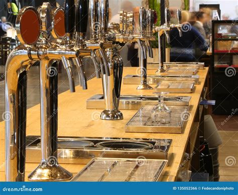 Beer Taps on the Counter of an Irish Pub Stock Photo - Image of london ...