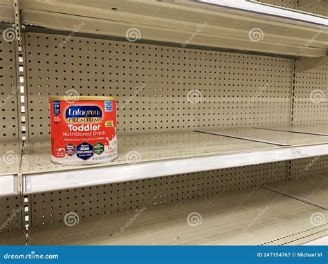 A baby formula display sits nearly empty at a Target store in Orlando.