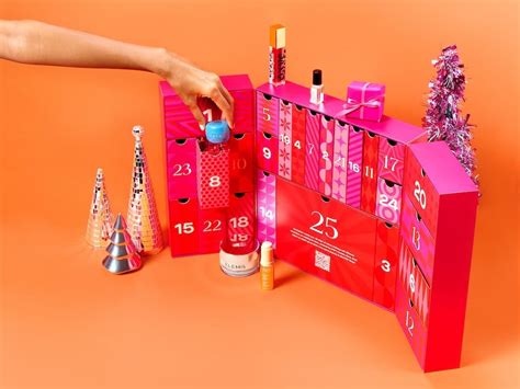 IPSY 2024 Beauty Advent Calendar open on an orange background with a ...