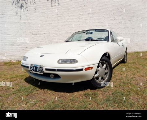 Old white sport 1990s Mazda MX-5 roadster on the grass. CADEAA 2023 Classic car show. Sunny day ...
