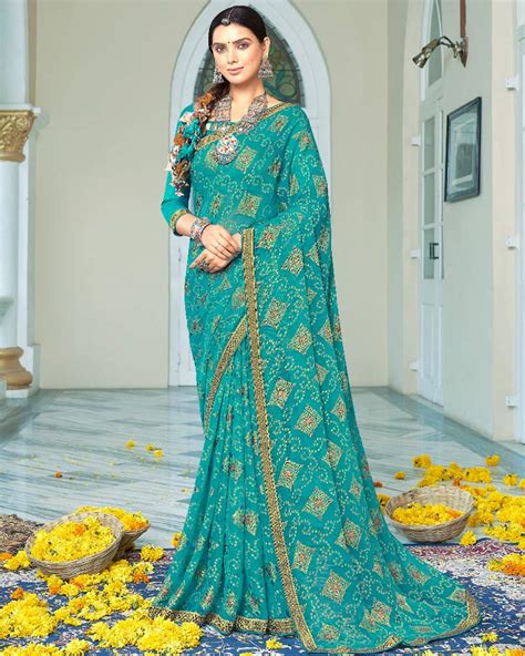 Vishal Prints Teal Blue Designer Brasso Saree With Foil Print And Zari