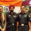 Hasleen Kaur with members of the President's bodyguard, is being given ...