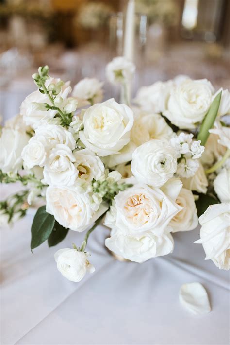 detail of elegant low lush all white centerpiece arrangement of vendela ...