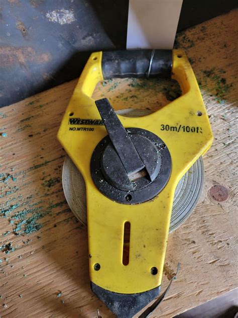 Qty of spray paint, rubber & 100 ft measuring tape