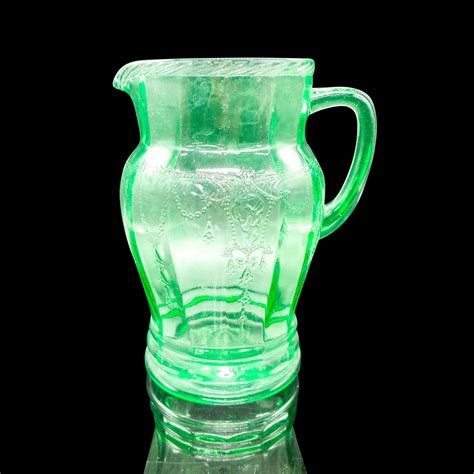 At Auction: Vintage Green Depression Glass Pitcher