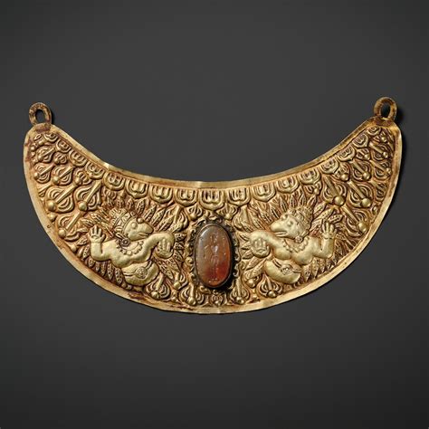 At Auction: A GOLD REPOUSSÉ PECTORAL PENDANT DEPICTING TWO GARUDA, VIETNAM, FORMER KINGDOMS OF ...