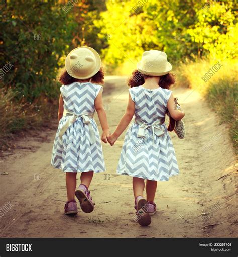 3 Little Girls Holding Hands