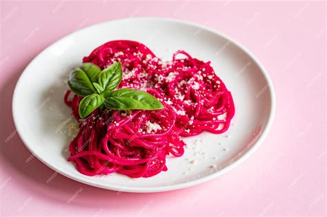 Premium Photo | Beetroot pasta barbie themed pasta pink noodles on pink ...