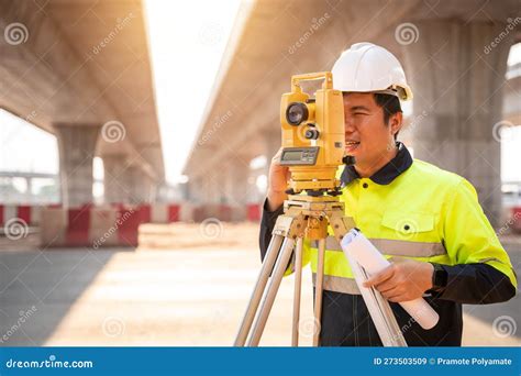 Asian Civil Engineer or Surveyor Making Measuring Under the Expressway ...