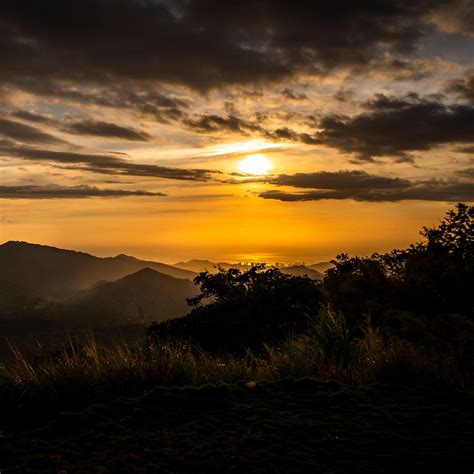 Download wallpaper 2780x2780 mountains, trees, silhouettes, sun, sunset ...