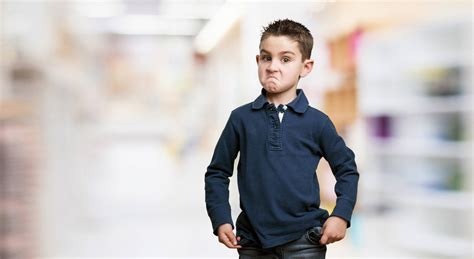 Download A Little Boy's Mean Pose Wallpaper | Wallpapers.com