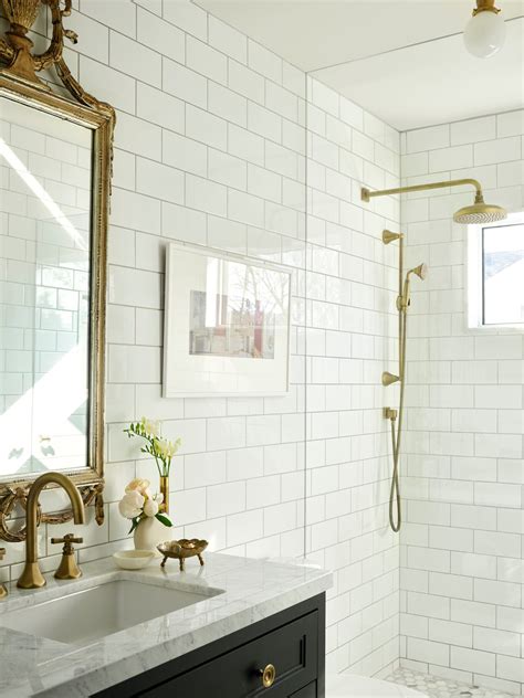 Large marble bath wall tiles with black hex bath floor tiles ...