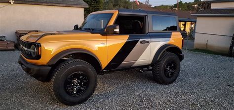 Mud flaps are ugly, so I went another direction with vinyl wrap ...