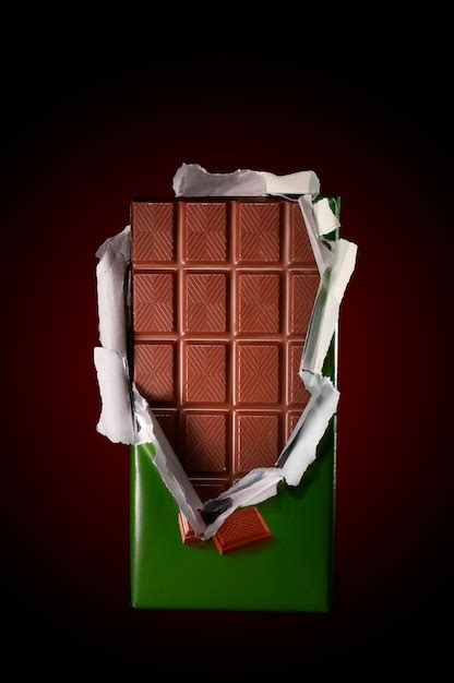 Chocolate in bar with open cover | Premium Photo