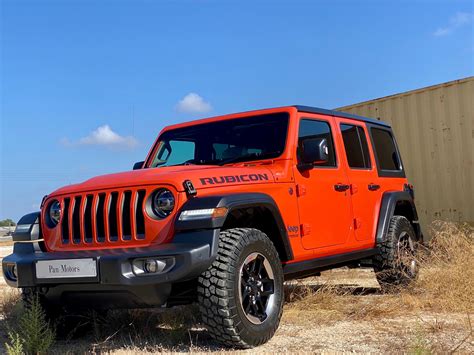 JEEP WRANGLER SAHARA IN SOLID PUNK’N ORANGE - PAN Motors