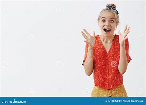 Studio Shot of Emotive and Joyful Girl Seeing Something Tremendous ...