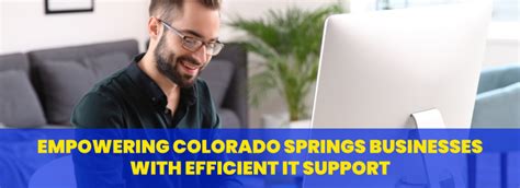 Man smiling while using a laptop, with text overlay "Delivering Colorado Springs with Efficient IT Support," emphasizing managed IT services relevance for local businesses.