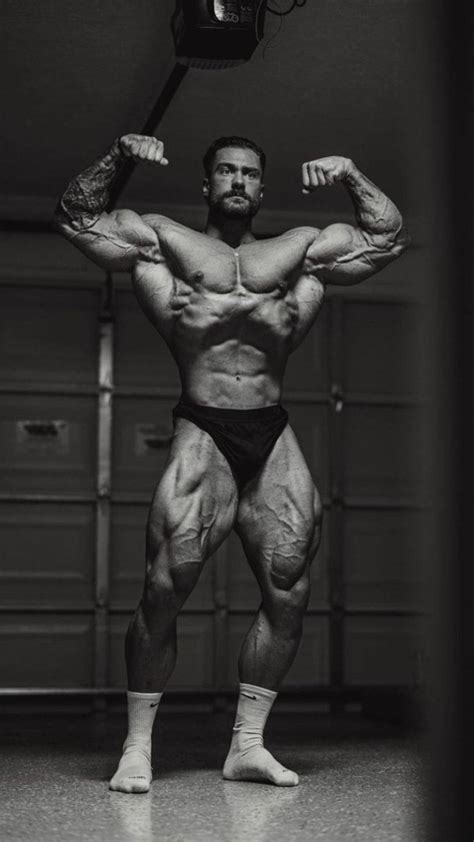 Download Chris Bumstead Double Front Bicep Pose Wallpaper | Wallpapers.com