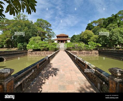 Royal Vietnamese temple surrounded by a serene pond - A beautiful ...
